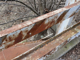 An eyelevel view of the disk on the bridge abutment.