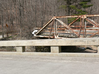 Looking N from the new bridge toward the old bridge, mark indicated.