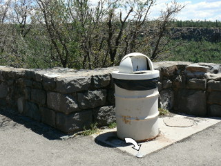 Looking SE; mark on corner of pad directly in front of trash can.