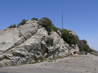 View from the ground of the rock mound(s) we had to climb to reach the mark. Also note the ‘forbidden’ tower.