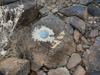 Eyelevel view of the disk set into a basalt boulder.