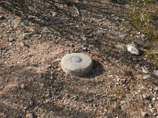 Eyelevel view of the disk in the concrete monument.