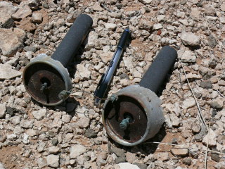 Remains of the old batteries we found (Rich’s pen included for scale).