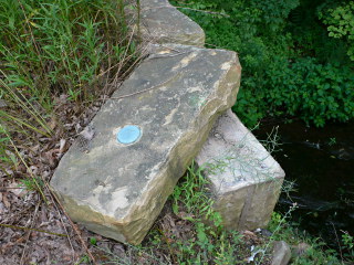 Eyelevel view of the disk on the disturbed stone.