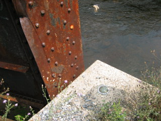 Eyelevel view of the disk on the bridge abutment.