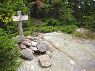 Looking SSE toward RM1 (on the small outcropping in the distance) from the summit sign near the station.