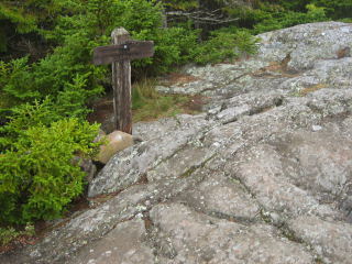 This sign is near the station and, though worn and damaged, can still be read.