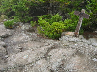 RM 1 is the closest mark to the Flying Mountain summit sign.