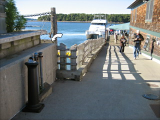 Looking down the pier, alongside the Fish House Grill building.