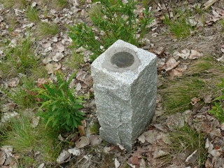 NPS #3: Eyelevel view of the boundary marker disk on granite monument