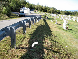 Looking SW along the small hill and toward the cemetery caretaker's shed.