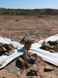 Eyelevel view of the disk and post. Note the unusual little witness sign. The mark has been prepared for aerial surveying.