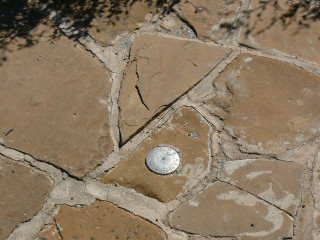 Eyelevel view of the disk in the rock walkway.