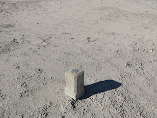 Eyelevel view of the disk in the concrete post.