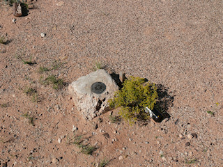 Eyelevel view of the disk in the concrete monument.