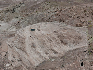 Eyelevel view of the mark on the rock outcrop at the edge of the mesa.