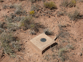 Eyelevel view of the reference mark in the concrete monument.