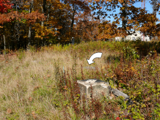 Foreground shows one of the remaining tower leg supports.