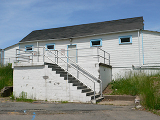 These stairs lead up to the building adjacent to the old swimming pool, which is now fenced off.