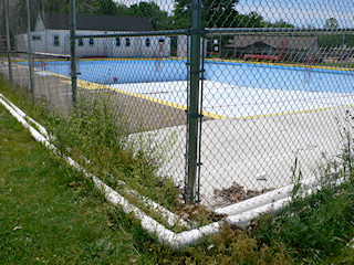 This is the NE corner of the pool, where the azimuth mark should have been located. Note that the concrete is new in comparison to the rest of the sidewalk surrounding the pool.