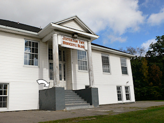 Looking NW from the front lawn of the old school building, mark indicated.