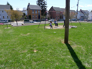 Looking SW toward a swingset and E North Street.