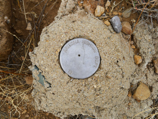 Eyelevel view of the disk set into concrete mound