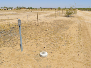 Looking NW along the fenceline to RM 2