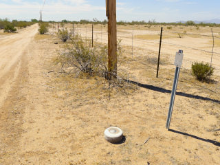 Looking SE along the fenceline toward RM 1