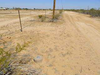 Looking NW along the fenceline toward the station