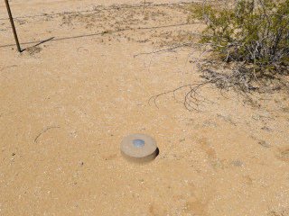 Eyelevel view of the reference mark disk on the monument