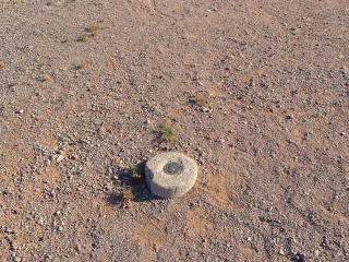 Eyelevel view of the disk in the round concrete monument