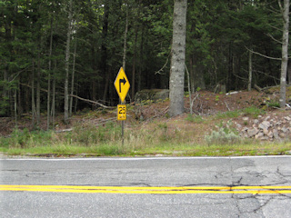 Proximity of the boulder to the (conveniently placed) sign!