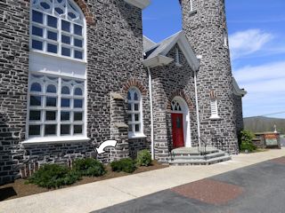 View of the SE wall of the church, showing the NE entrance.