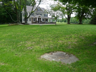 Eyelevel view of mark on outcrop, looking S toward residence (1969 Glenwood Rd.).