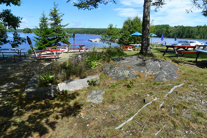 The benchmark disk is located in the picnic/outdoor seating area adjacent to Bagaduce Lunch.