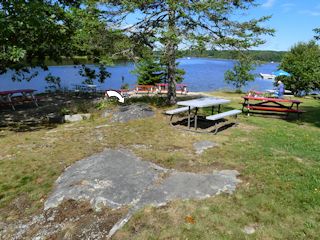 The mark is on the outcrop in the distance, not the closer one that is visible from Google Street View.