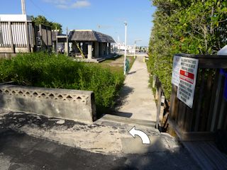 Eyelevel view of the mark (indicated) set in concrete dock footing.