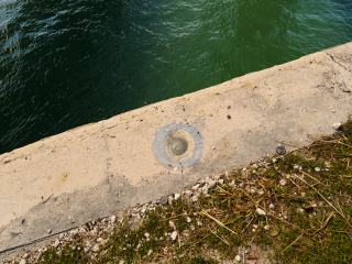 Eyelevel view of the disk on the bridge wingwall.