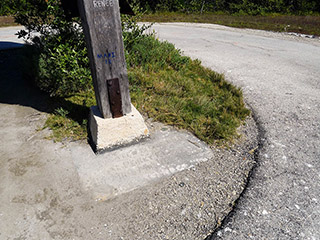 Benchmark and carved inscription on tower base