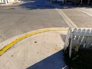 Eyelevel view of the disk on the sidewalk.