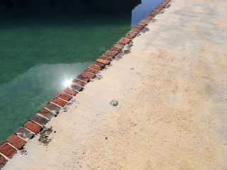 Eyelevel view of the disk set in the moat wall.