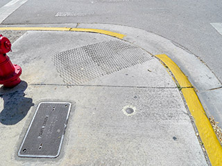 Eyelevel view of the disk in the sidewalk