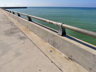 Eyelevel view of the disk on the curb of the pier.