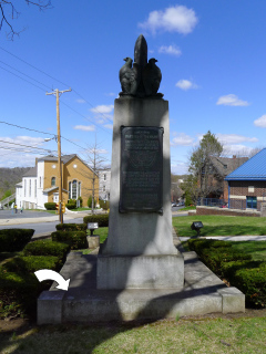 The disk’s position on the corner of the monument.