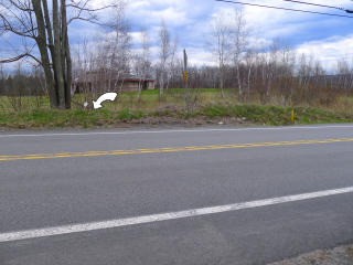 Looking E across Route 191 toward the mark.