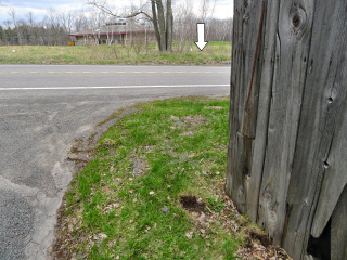 Looking E across Route 191 toward the station (indicated).