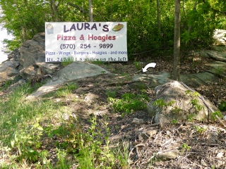 Proximity of the disk to the sign currently on the outcrop