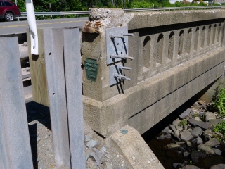 Eyelevel view of the disk on the SE wingwall of the bridge.