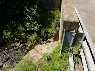 Eyelevel view of the disk on the bridge wingwall.